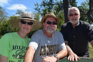 Chit-chatting along the Broadkill are (l-r) Milton residents Debby Andreson, Jack Moore and Milton Mayor Ted Kanakos.