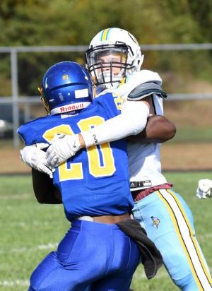 Cape defensive back Ben Ashby, right, meets Sussex Central halfback Zion Reed head-on to stop a long gain.