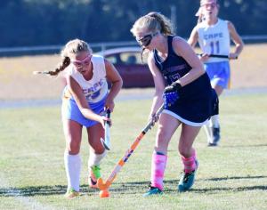 Beacon’s Casey Schnupp, left, and Sussex Academy’s Brooke Farrell battle for a 50/50 ball in the midfield.