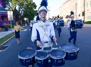 Dru Simmons leads the percussion section with the tenor drums.