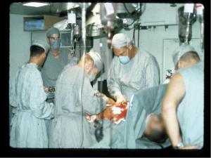 Dr. Mayer Katz, second from left, operates on a troop wounded during the battle of Hue in Vietnam. Katz said surgical teams saved more than 90 percent of patients on whom they worked. Katz Surgery MASH Vietnam Huè