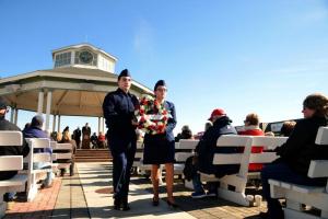 Civil Air Patrol Base 2 memorial squadron Cadets William Stanton, left, and Llian Taylor prepare to post the wreath at the memorial.