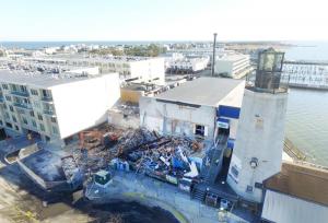 As evidenced by the lighthouse, the hotel and the large electrical transformer, demolition is a dirty job, but it takes skill too. CHRIS FLOOD PHOTO