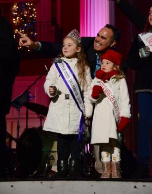 Sen. Ernie Lopez, R-Lewes, points out the arrival of Santa Claus to Little Miss Delmarva Adeline Lutz and Little Miss Georgetown Brystal Mears.