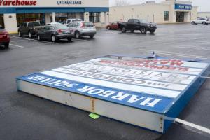 The Route 1 Harbor Square shopping center sign near Rehoboth Beach is toppled by the strong wind. RON MACARTHUR PHOTO
