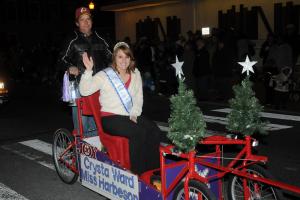 Miss Harbeson Crysta Ward rides in her homemade sleigh made by her father Carl, who rides on the back. BY DAN COOK