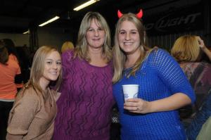 Ashley Turner, left, attends the feast with mother and daughter Lisa, left, and Shannon Thorp. BY STEVEN BILLUPS