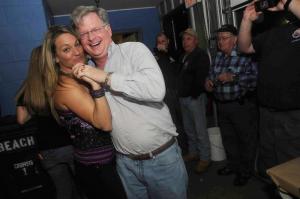 Tired of watching the firemen hold up the wall, Cristin Lewis pulls event organizer Brian Pepper onto the dance floor. BY STEVEN BILLUPS