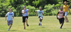 The four finalists take off in the finals of the 50-yard dash. In the race are (l-r) Gabe Bailey, Vinnie Street, Andre Currie and Kris Rushin. Street ended up crossing the finish line in first place. BY RON MACARTHUR