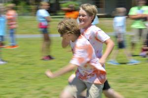 Camp Steiner and Wyatt Fruehaff are a blur of motion as they race in the rescue relay. BY RON MACARTHUR