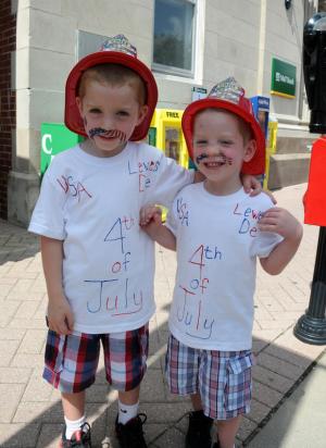 Drake, 4, and Hunter, 2, O'Neill of Georgetown sport their patriotic mustaches and shirts at the kids games. BY DAN COOK