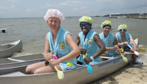 Team Rudder Duckie members (l-r) Yelena Kretova, Kyle Carney, Autumn Longoria and Robert Brooks from the Rusty Rudder hope to paddle their way to victory with bath scrubbers. BY DENY HOWETH