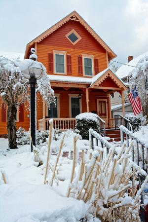 A colorful house on Kings Highway in Lewes provides contrast for the snow covering the yard and walkway. BY RON MACARTHUR