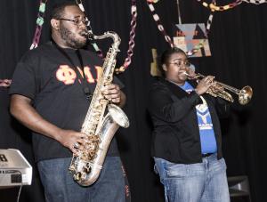 Musicians Cortney Williams, left, and Grace Batten from Delaware State University perform in a trio. BY DENY HOWETH