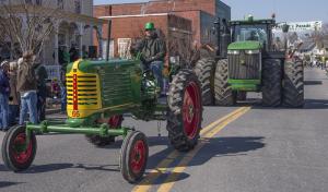 Milton's agricultural history was represented by an Oliver 66 tractor and a new John Deer tractor. BY DENY HOWETH
