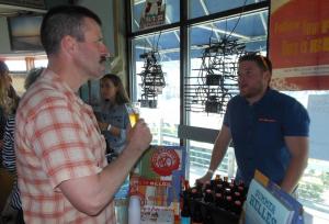 Jake Callard of Lewes and Jon Sipes, representing New Belgium Brewing, discuss the finer points of beer making during the brew fest at Gary's Dewey Beach Grill. BY CHRIS FLOOD