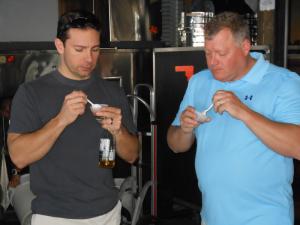 Joe Wobeter, left, of Milton and Matt Hill of Richmond, Va., taste the chili from the Rusty Rudder. Nearly 30 participants entered this year's Rusty Rudder Chili Cook-Off. The judges' first place restaurant was Delaware Distilling Company, while Nicola took second place. The judges first place individual was Dennis Neason from Triple A Chili. People's Choice and Best Decorated Table both went to Ocean View resident Lisa Abel. BY CHRIS FLOOD