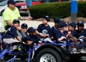 Rehoboth Little League teams parade around Rehoboth Avenue before the opening day ceremonies at the fields. BY PAT IRELAN