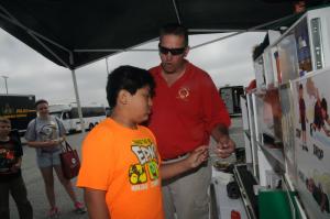 Bridgeville Fire Safety Officer John Tomeski congratulates Fabian Vasquez from Georgetown Elementary for selecting the right hazardous item to remove from the house. BY STEVEN BILLUPS