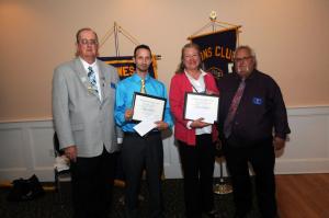 Lions Club licence plates were presented to club members. Shown are (l-r) King Lion Pete Dirks, license recipients Chris Russ and Elizabeth Hicks and George Russ. BY STEVEN BILLUPS