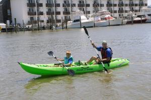 Taking a paddle on the canal with a Quest Kayak are Josiah and his dad Darrin Sample. BY STEVEN BILLUPS