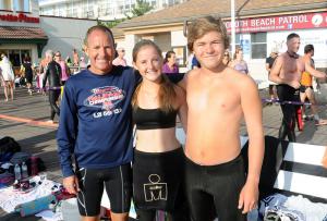 The Brokaw clan of (l-r) Rick, Grace and Ricky pose for a picture before hitting the surf. BY DAN COOK