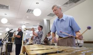 The Shore Jazz All Stars entertain guests with jazz selections. Paul Midiri on vibes is accompanied by John Ewart on sax, left, and Danny Tobias on trumpet. BY DENY HOWETH
