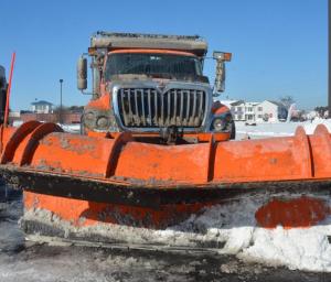 Ice and snow cover a DelDOT snow plow. RON MACARTHUR PHOTO