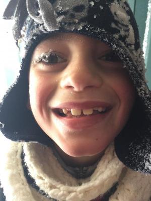 Peyton Vied is clearly very excited to play in the snow. MORGAN MURR PHOTO