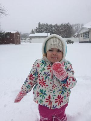Elliana Pentoney, 2, plays in the snow outside her home in Rehoboth. ERICA PETONEY PHOTO