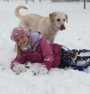 Maya Yngve enjoys the snow with her puppy, Summer. CARLA YNGVE PHOTO