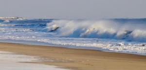 Wind creates spray as waves break along the coast near Rehoboth Beach. RON MACARTHUR PHOTO