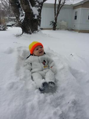 James, 4 months, experiencing his first snow! Submitted by Liz Cinque.