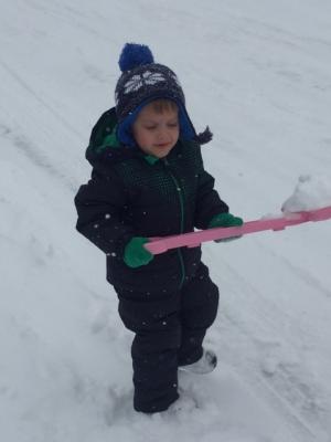 Michael Justice, 3, helps shovel snow. COURTNEY JUSTICE PHOTO