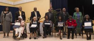 Richard Allen School Alumni were honored with commendations from the House of Representatives signed by Ruth Briggs-King. Shown seated (l-r) are Marian Abbott Thomas, Eunice Richardson, Clara Ingram, Marie Melvin, Evelyn Ingram and Alva Bell. In back are Vivian Burton accepting the commendation for her mother, Frances Phillips, the Rev. Eugene Abbott, Diaz Bonville, Harry Crapper, Solomon Henry, and Jane Hovington, board president.