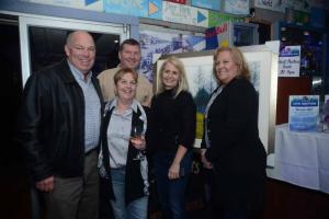Gathered in front of Nick Serratore’s pastel landscape live auction item are (l-r) Rep. Pete Schwartzkopf, D-Rehoboth; Patricia Olipant, Sussex Academy director; Gina Derrickson, event chair; and Carol Schwartzkopf. In back is event host and co-chair Steve “Monty” Montgomery.