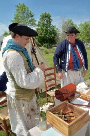 Kyle Dalton of Edgewater, Md,, left, and Buzz Mooney of Hagerstown, Md., demonstrate navigational aids used throughout the years. RON MACARTHUR PHOTO