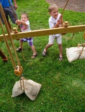 Pulling hard on black and tackle on the Zwaanedael Museum grounds are Grayson, left, and Gavin Charles of Lewes as they take part in the museum’s Maritime Celebration. RON MACARTHUR PHOTO