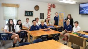 Upper School freshmen are excited to learn about Honors Physical Science in Colleen McGuire's newly renovated Innovation Lab. Shown are (l-r) C.C. Lizas, Berlin, Md.; Lexi Willey, Milton; Mason Brown, Rehoboth Beach; Daniel Chen, Salisbury; Vincent Petrera, Salisbury, Hunter Gentry, Selbyville; Marika Vasilikos, Rehoboth Beach; Maddy Warren Salisbury; teacher Colleen McGuire; Joseph Schwartz, Salisbury; and Chipper Becker, Rehoboth Beach.