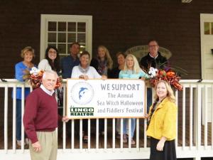 Jack Lingo Realtor is a Swell Wave Sponsor for Sea Witch. Shown are in back (l-r) Carol Everhart, chamber president; Emily Grothey, chamber events coordinator; and Jack Lingo Realtor sales agents Lucius Webb, Angie Watkins, Cheryl Crowe, Jessica Bradley, Allison Bateman and Rick Monkman. In front are John Lingo, manager, Jack Lingo Realtor Lewes office, and Karen Falk, director of marketing and communications, Jack Lingo Realtor.