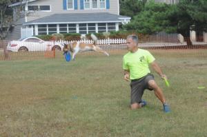 The Mid-Atlantic Disc Dogs performed for the crowd at the event. Shown is Bentley getting air with his trainer Frank Montgomery. Bark on the Boards