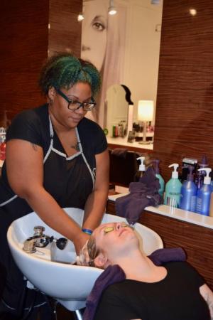Lewes resident Ambre Jones washes Rehoboth Beach resident Brittany Wangen's hair during the service-a-thon.