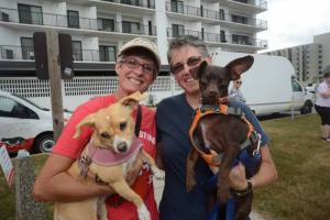 Ready for the walk are Charity Farrell with Olive, left, and Lisa Roddis with Zack from Salisbury, Md. Bark on the Boards