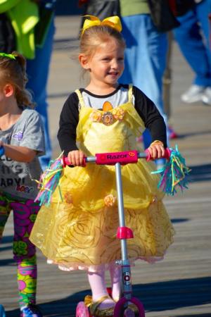 Princess Emma Stallings of Baltimore gets off to start on her scooter during the tyke bike roll. RON MACARTHUR PHOTO