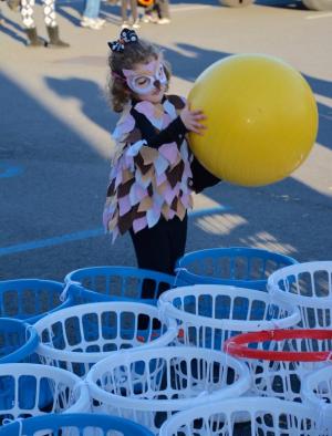 Taking aim with a large ball is Lily VanVorst – dressed as an owl – of Seaford as she takes part in one of the games at the Sussex Family YMCA. RON MACARTHUR PHOTO