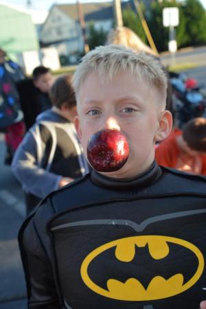 He’s got it. Caidyn Schaeffer, visiting with his family from Pennsylvania, is successful bobbing for an apple in the fall fun event at Sussex Family YMCA. RON MACARTHUR PHOTO