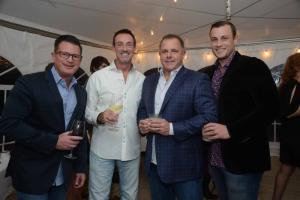 Blue Coast Grill employees stick together at the event. Shown are (l-r) host Bob Suppies, server Eric Overnman, Dave Gorce and bartender Tyler Townsend. SoDel Cares Fundraiser