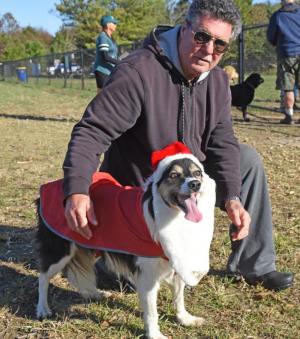 Bonnie, a 12-year-old border collie, was making sure all dogs were on the nice list this year. She is shown with owner Arno Lehmann of Lewes.