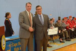 Cape Henlopen School District Superintendent Robert Fulton, left, and Rep. Steve Smyk, R-Milton, presented certificates to area veterans at the JROTC Veterans Day celebration at Cape High.