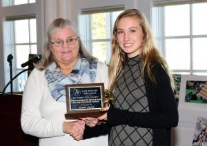 Darby Klopp, right, receives the Mike Eisenhour Dedication to the Program Award from former coach Ruth Skoglund.